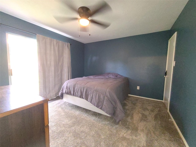 405 Wakefield Rd, Conroe, TX 77316 - carpeted bedroom with baseboards and ceiling fan