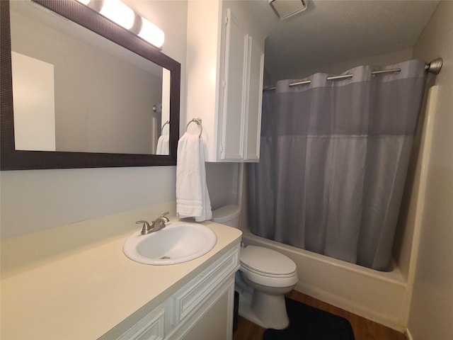 405 Wakefield Rd, Conroe, TX 77316 - bathroom with toilet, vanity, shower / bath combo, and wood finished floors