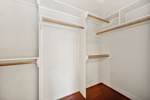1938 Norfolk St, Houston, TX 77098 - walk in closet featuring dark wood finished floors