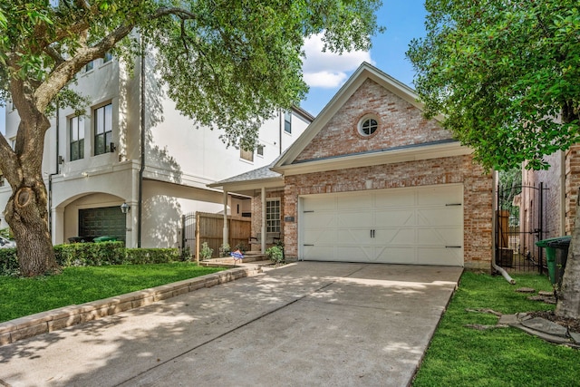 1938 Norfolk St, Houston, TX 77098 - view of front of home with concrete driveway, brick siding, an attached garage, and stucco siding