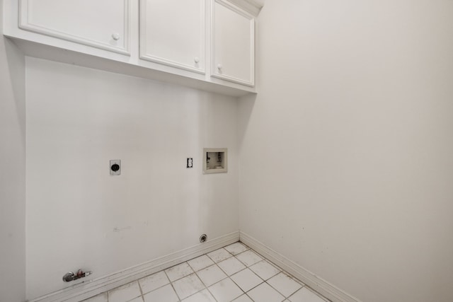 1938 Norfolk St, Houston, TX 77098 - washroom with washer hookup, electric dryer hookup, baseboards, gas dryer hookup, and cabinet space