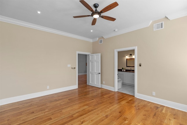 1509 Summer St, Houston, TX 77007 - unfurnished bedroom featuring ornamental molding, light wood-style flooring, baseboards, ensuite bath, and recessed lighting