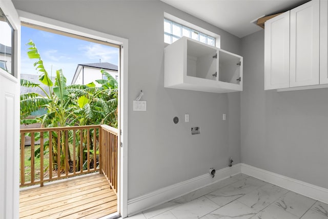 1509 Summer St, Houston, TX 77007 - washroom with baseboards, hookup for an electric dryer, light marble finish floors, cabinet space, and washer hookup