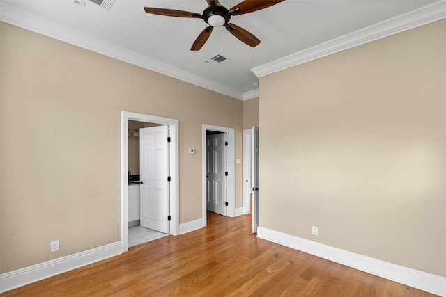 1509 Summer St, Houston, TX 77007 - unfurnished bedroom with ornamental molding, light wood-type flooring, baseboards, and a ceiling fan