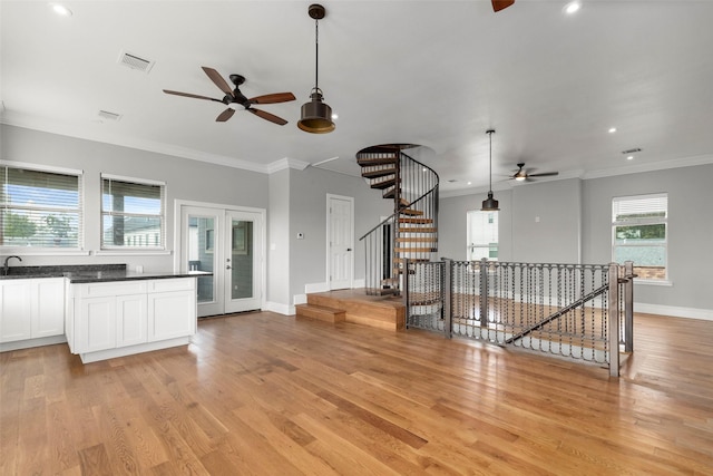 1509 Summer St, Houston, TX 77007 - unfurnished living room featuring a ceiling fan, light wood-style flooring, ornamental molding, baseboards, and recessed lighting