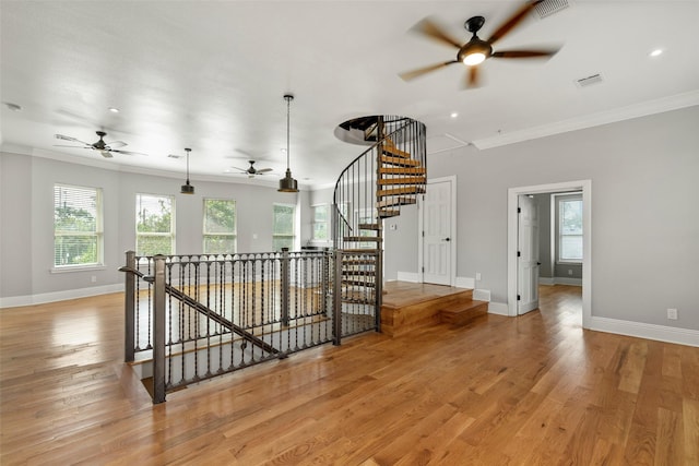 1509 Summer St, Houston, TX 77007 - staircase with a ceiling fan, crown molding, healthy amount of natural light, baseboards, and wood finished floors