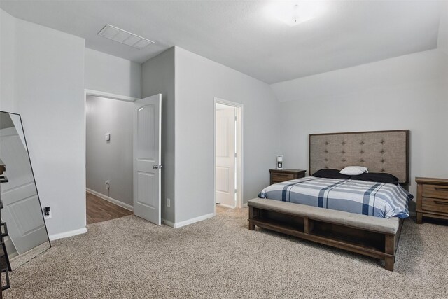 12911 Italian Cypress Trl, Houston, TX 77044 - carpeted bedroom with baseboards and lofted ceiling