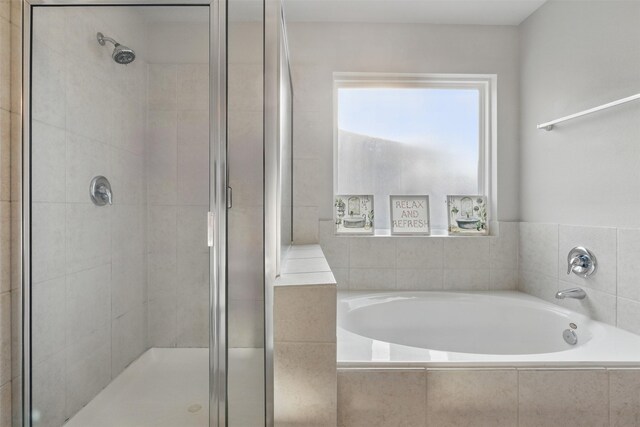12911 Italian Cypress Trl, Houston, TX 77044 - full bathroom with a shower stall and a bath