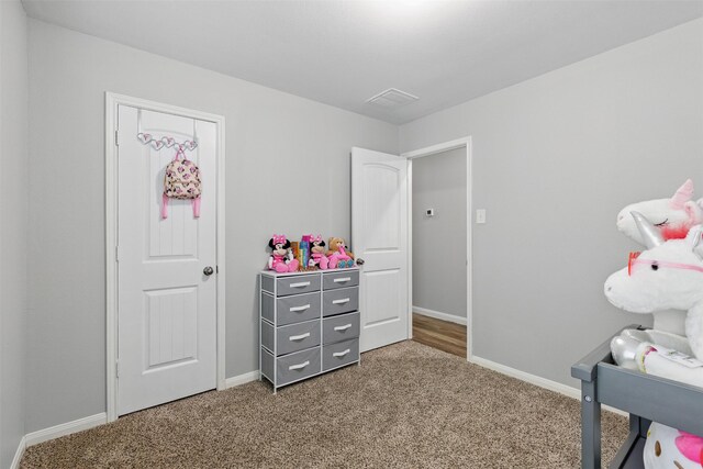 12911 Italian Cypress Trl, Houston, TX 77044 - carpeted bedroom with baseboards