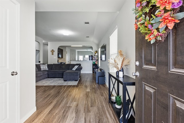 12911 Italian Cypress Trl, Houston, TX 77044 - foyer entrance with arched walkways, wood finished floors, and baseboards