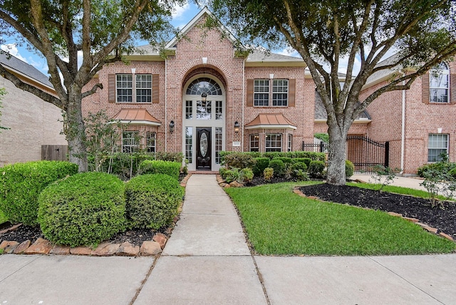 1611 Whitfield St, Sugar Land, TX 77479 - traditional home featuring brick siding and a standing seam roof