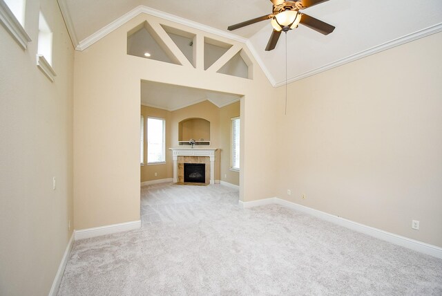 1611 Whitfield St, Sugar Land, TX 77479 - unfurnished living room with light carpet, a ceiling fan, a tile fireplace, baseboards, and high vaulted ceiling