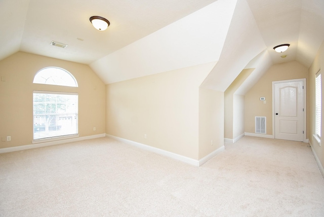 1611 Whitfield St, Sugar Land, TX 77479 - additional living space featuring lofted ceiling, light carpet, and baseboards