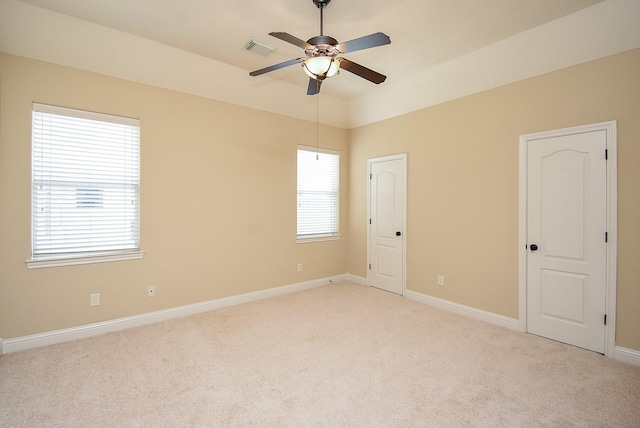 1611 Whitfield St, Sugar Land, TX 77479 - unfurnished bedroom featuring light carpet, baseboards, and a ceiling fan