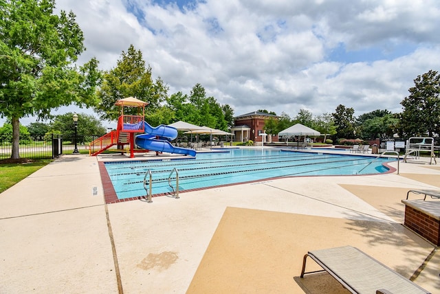 1611 Whitfield St, Sugar Land, TX 77479 - community pool with a water slide and a patio