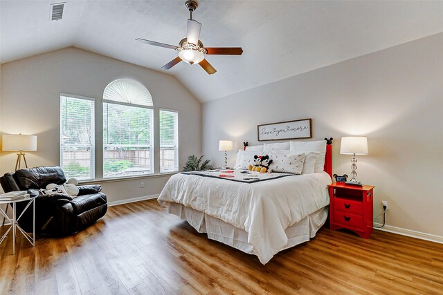 2102 Ivy Cove Ct, Katy, TX 77494 - bedroom with wood finished floors, baseboards, vaulted ceiling, and a ceiling fan