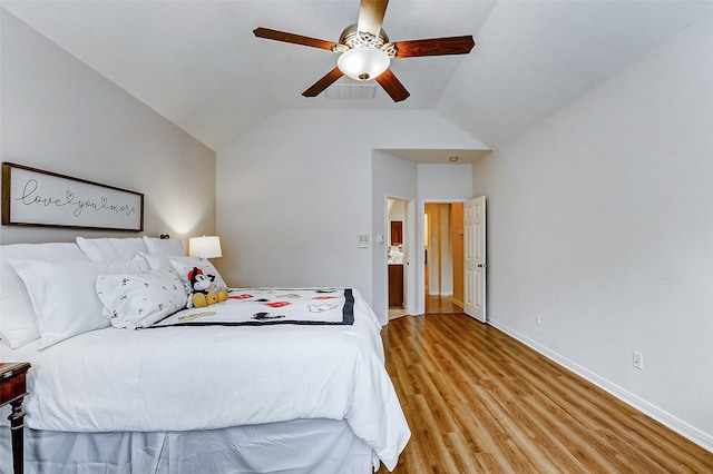 2102 Ivy Cove Ct, Katy, TX 77494 - bedroom with light wood-type flooring, baseboards, ceiling fan, and lofted ceiling