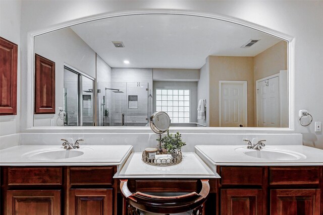 2102 Ivy Cove Ct, Katy, TX 77494 - bathroom featuring two vanities and a shower stall