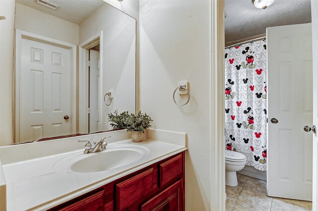 2102 Ivy Cove Ct, Katy, TX 77494 - bathroom with vanity, toilet, tile patterned flooring, and a shower with shower curtain