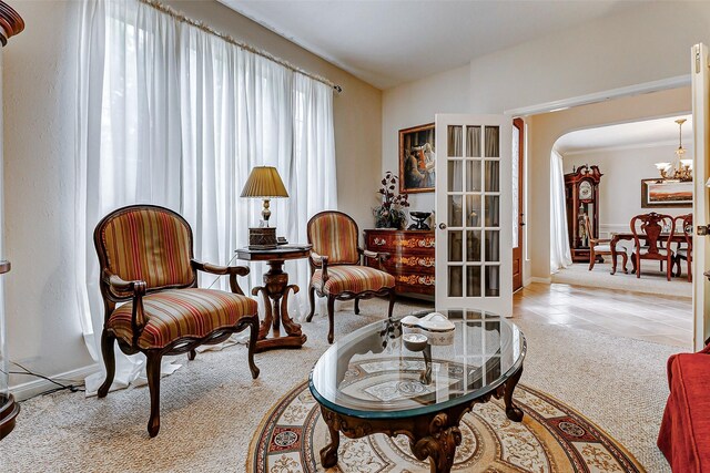 2102 Ivy Cove Ct, Katy, TX 77494 - sitting room featuring carpet, a chandelier, arched walkways, and baseboards