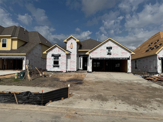 2605 Bisbee Rd, League City, TX 77573 - unfinished property with driveway, a garage, and a shingled roof