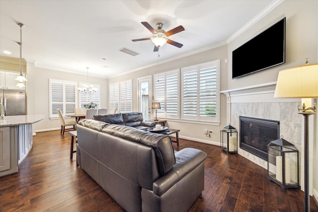 8918 Aventino Way, Houston, TX 77080 - living room with ceiling fan, dark wood-style flooring, plenty of natural light, ornamental molding, and a fireplace