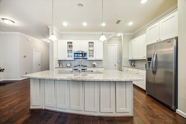 8918 Aventino Way, Houston, TX 77080 - kitchen featuring stainless steel appliances, crown molding, backsplash, white cabinetry, and recessed lighting