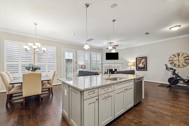 8918 Aventino Way, Houston, TX 77080 - kitchen with a sink, stainless steel dishwasher, a fireplace, crown molding, and a chandelier