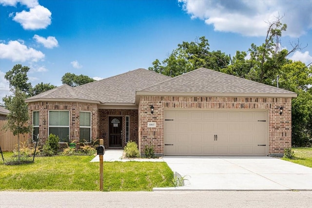 6507 Radcliffe St, Houston, TX 77091 - view of front of property featuring brick siding, an attached garage, a front yard, and driveway