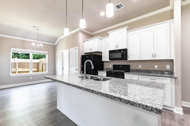 6507 Radcliffe St, Houston, TX 77091 - kitchen featuring black appliances, a sink, crown molding, dark wood-style flooring, and white cabinetry