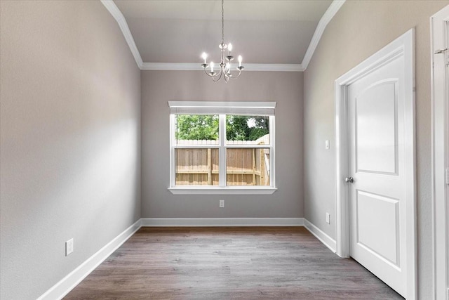 6507 Radcliffe St, Houston, TX 77091 - empty room featuring crown molding, a chandelier, wood finished floors, and baseboards