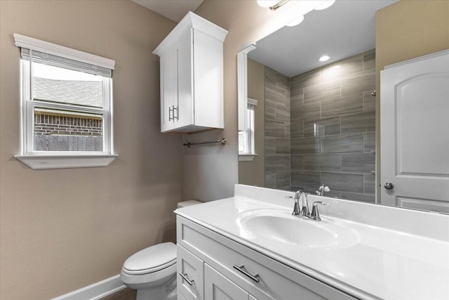 6507 Radcliffe St, Houston, TX 77091 - bathroom with toilet, vanity, baseboards, and a tile shower