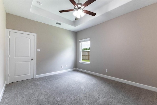 6507 Radcliffe St, Houston, TX 77091 - carpeted empty room with a raised ceiling, ceiling fan, baseboards, and a smoke detector