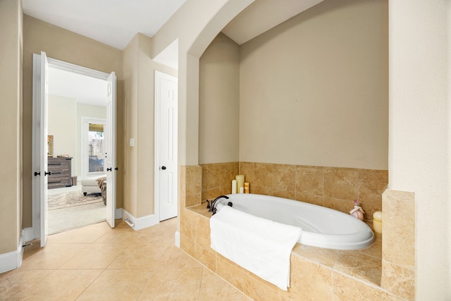 6019 Majestic Pines Dr, Houston, TX 77345 - bathroom with a bath, tile patterned flooring, and baseboards