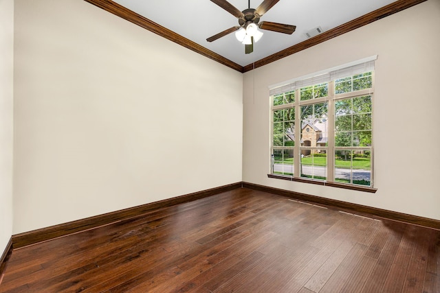 6019 Majestic Pines Dr, Houston, TX 77345 - spare room with baseboards, crown molding, dark wood-type flooring, and ceiling fan