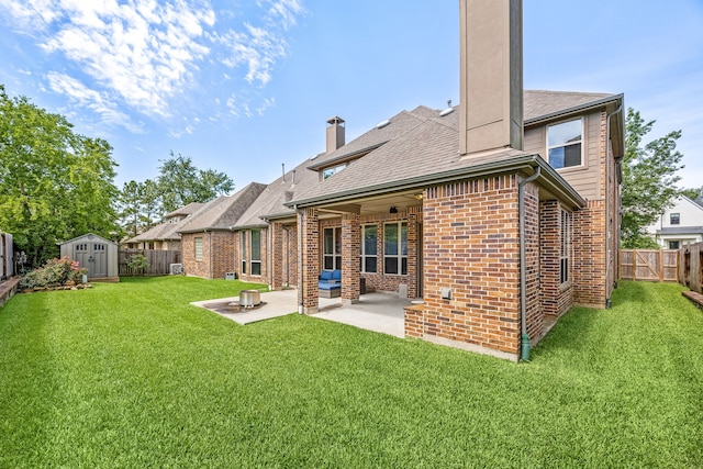 6019 Majestic Pines Dr, Houston, TX 77345 - rear view of house featuring a chimney, a patio, brick siding, and a shingled roof