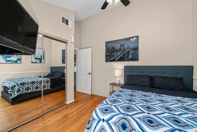 3002 Ashford Oak Dr, Houston, TX 77082 - bedroom with a closet, wood finished floors, a ceiling fan, and a high ceiling