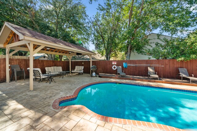 3002 Ashford Oak Dr, Houston, TX 77082 - view of swimming pool with a gazebo, a patio area, a fenced backyard, and an outdoor living space