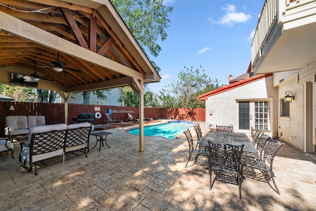 3002 Ashford Oak Dr, Houston, TX 77082 - view of swimming pool with french doors, a fenced backyard, an outdoor living space, ceiling fan, and outdoor dining space