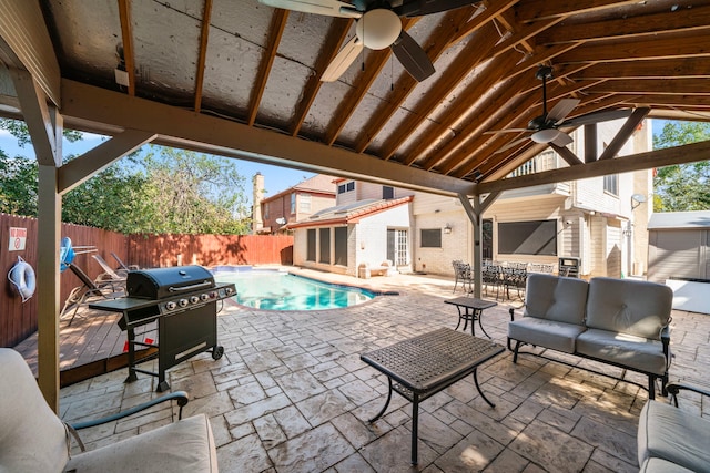 3002 Ashford Oak Dr, Houston, TX 77082 - fenced backyard featuring ceiling fan, a patio, area for grilling, an outdoor living space, and an outdoor structure