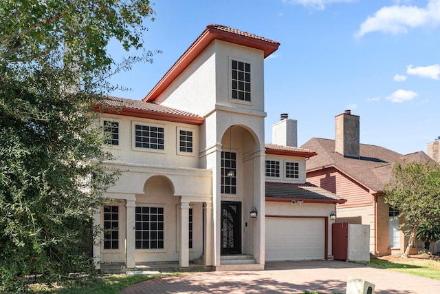 3002 Ashford Oak Dr, Houston, TX 77082 - mediterranean / spanish-style house with concrete driveway, a tile roof, and stucco siding