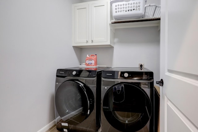 1540 Lawrence St, Houston, TX 77008 - laundry room with washing machine and clothes dryer, cabinet space, and baseboards