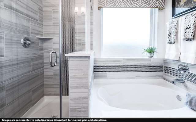 703 French Lavender Ln, Crosby, TX 77532 - full bath featuring a shower stall, a bath, and healthy amount of natural light