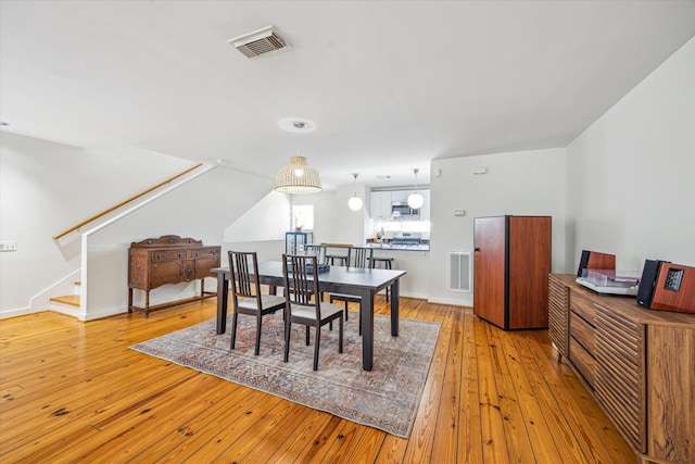 2720 La Branch St, Houston, TX 77004 - dining room featuring light wood-style flooring and stairway