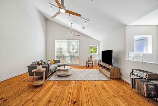 2720 La Branch St, Houston, TX 77004 - living room featuring a ceiling fan, hardwood / wood-style floors, lofted ceiling, track lighting, and baseboards