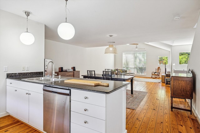 2720 La Branch St, Houston, TX 77004 - kitchen with dishwasher, a sink, a peninsula, and dark countertops