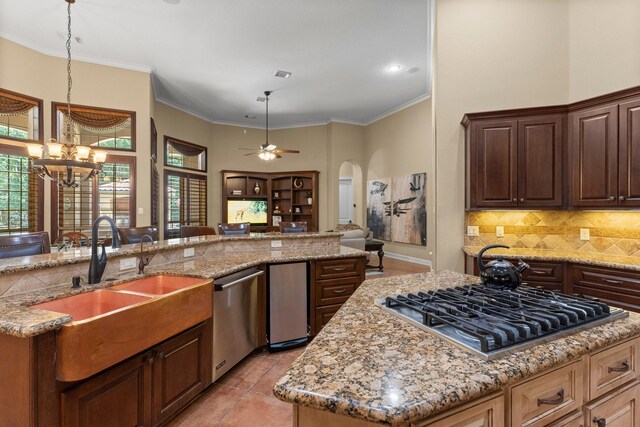 4022 Hidden Winds Dr, Spring, TX 77386 - kitchen with a center island, a sink, open floor plan, stainless steel appliances, and healthy amount of natural light