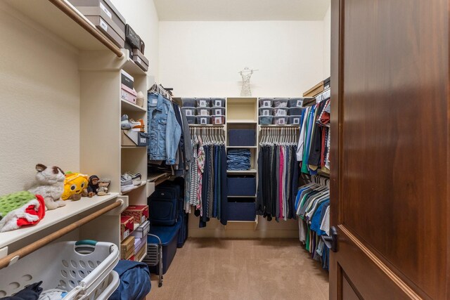 4022 Hidden Winds Dr, Spring, TX 77386 - walk in closet featuring light carpet