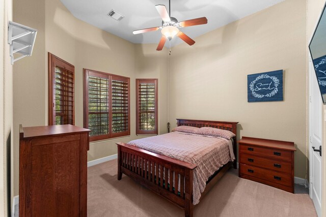 4022 Hidden Winds Dr, Spring, TX 77386 - bedroom with light carpet, baseboards, and ceiling fan