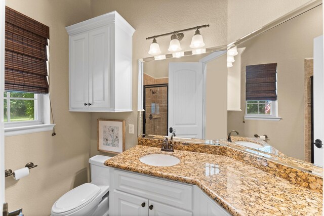 4022 Hidden Winds Dr, Spring, TX 77386 - full bath featuring vanity, toilet, and a shower stall